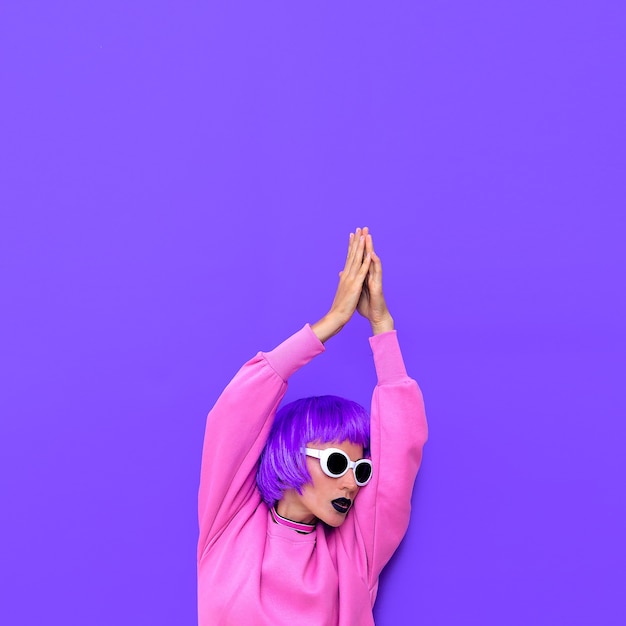 Stylish girl with purple hair. colorful fashion style