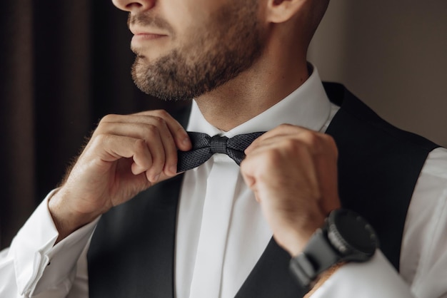 A stylish groom is preparing for the wedding ceremony