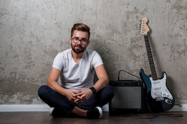 Stylish guy with a guitar