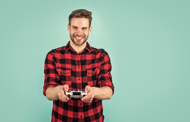 Stylish guy with trendy hairstyle wear checkered shirt playing video game hobby