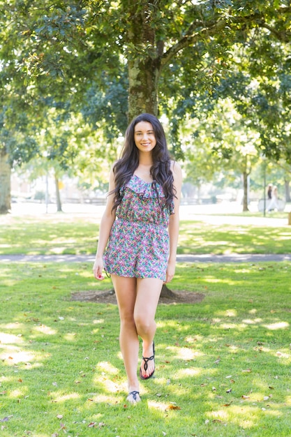 Stylish happy brunette looking at camera