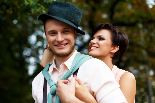 Stylish happy couple fooling around