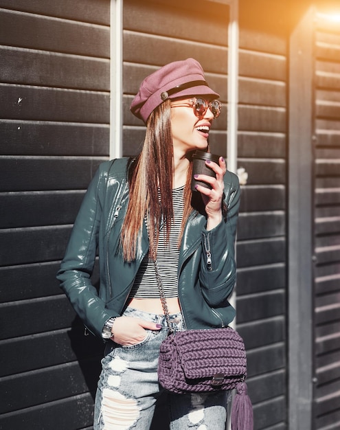 Stylish happy young woman wearing jeans