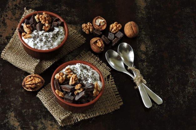 Stylish healthy breakfast or snack. Chia yogurt, chocolate and walnuts. Keto diet. Keto breakfast.