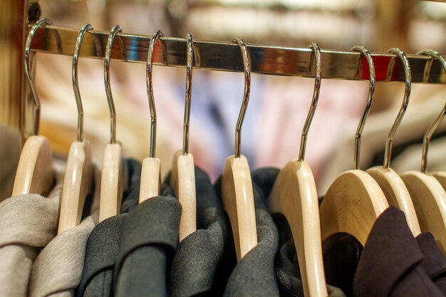 Stylish jackets hanging on the rack in the store