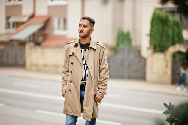 Stylish kuwaiti man at trench coat