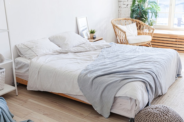 Stylish loft bedroom interior with light walls