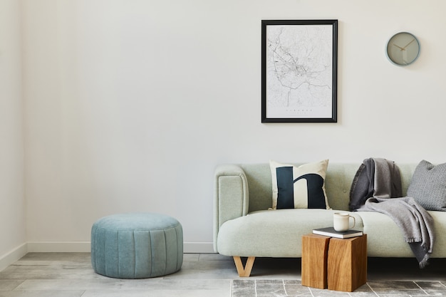 Stylish loft interior with green sofa, design pouf, poster map, furniture,  carpet, plants, decoration and elegant accessories. Modern home decor.