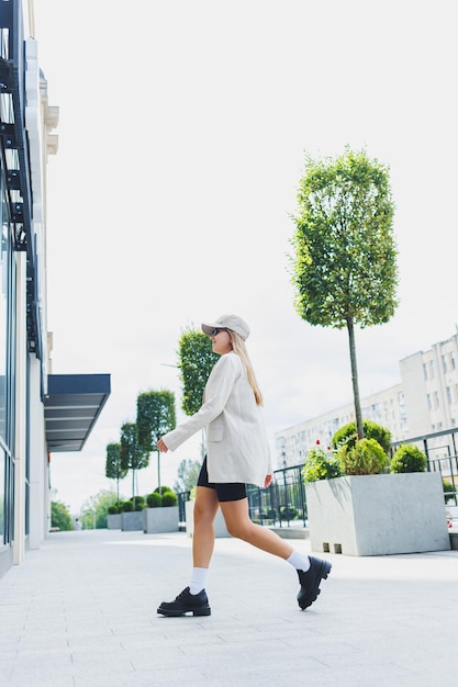 Stylish look Black women's shoes Fashionable woman on the street Photo of a woman in the city