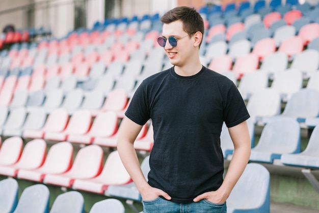 A stylish man in a black T-shirt. Street photo