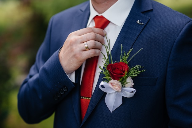 Stylish man holding a butterfly close-up. Fashion.