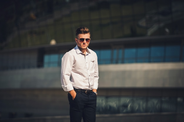 Stylish man in a shirt and sunglasses