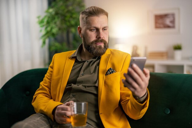 Stylish mature man drinking hot tea