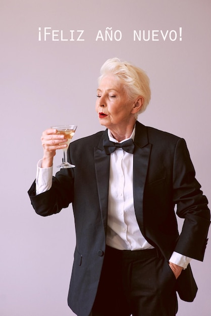 stylish mature senior woman in tuxedo celebrating new year Fun party party is over style celebr