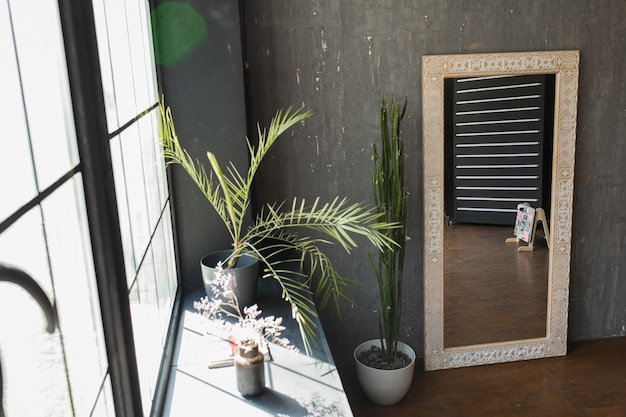 Stylish mirror on a gray wall background