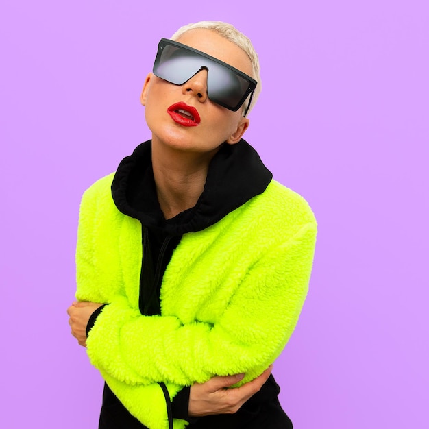 Stylish model wearing fashion sunglasses and jacket acid