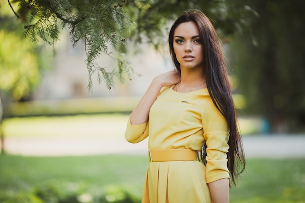 Stylish model in yellow dress