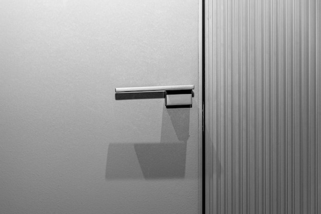 Stylish modern profiled gray door with a handle Fashion trends in decor and interior design Closeup