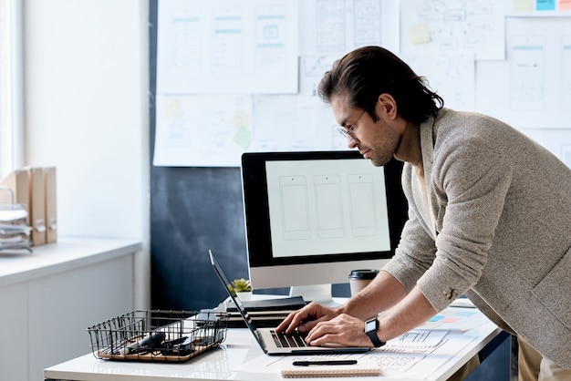 Stylish Office Worker Using Laptop