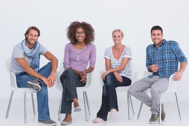 Photo stylish people sitting and smiling at camera