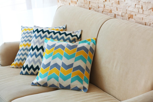 Photo stylish pillows on grey couch