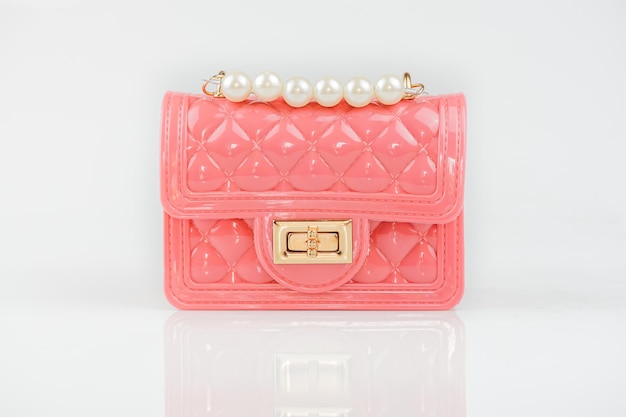 Stylish pink ladies handbag isolated on background