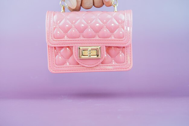 Stylish pink ladies handbag isolated on background