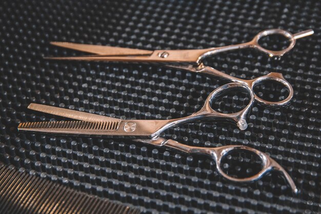 Stylish professional barber scissors. Hairdresser salon concept, hairdressing tool set