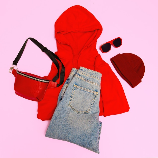 Stylish red accessories clutch, cap, sunglasses and red hoodie.  Street casual fashion