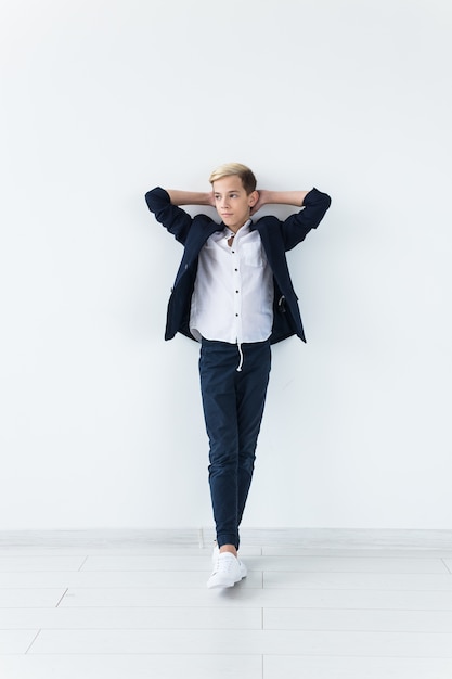 Stylish schoolboy teenager wearing suit