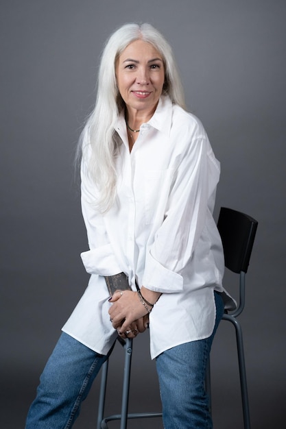 Stylish senior woman with long hair