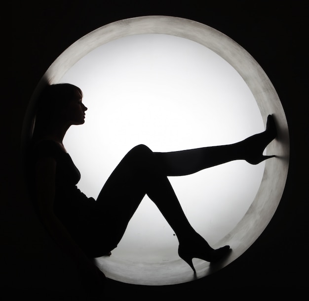 Stylish silhouette  woman in circle