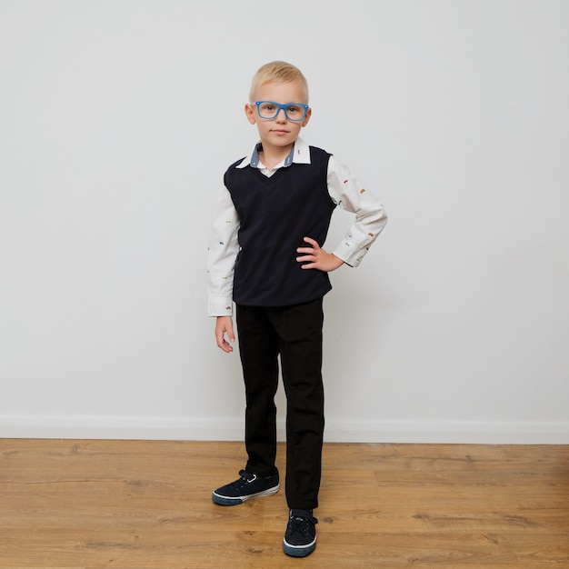 Premium Photo | Stylish trendy little boy in glasses.