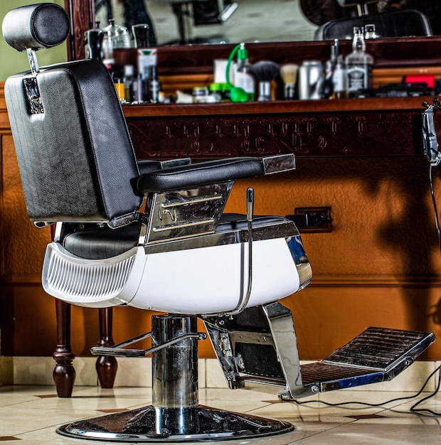 Stylish vintage barber chair Barbershop theme Professional hairstylist in barbershop interior Barber shop chair Barbershop armchair modern hairdresser and hair salon barber shop for men