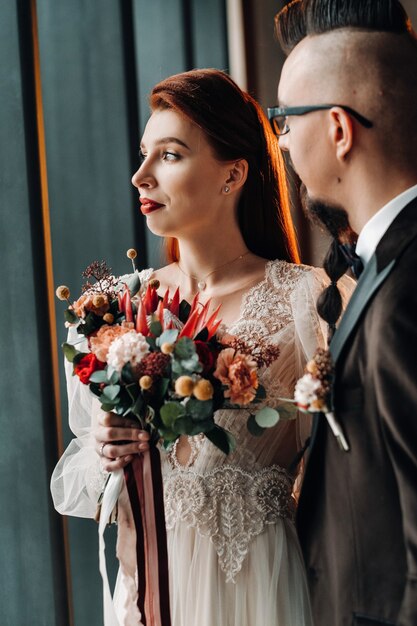 Stylish wedding couple in the interior