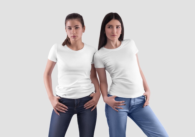 Stylish white women's Tshirt on two darkhaired pretty girls in jeans front view