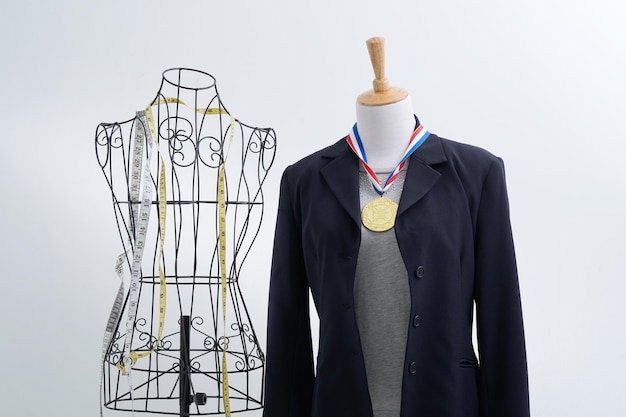 Stylish wire tailor\'s mannequin and retro vintage mannequin\
with medal