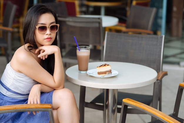 Stylish woman in cafe