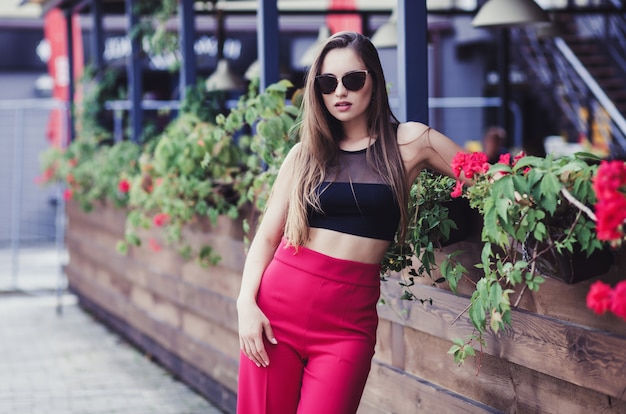 Stylish woman walking on street