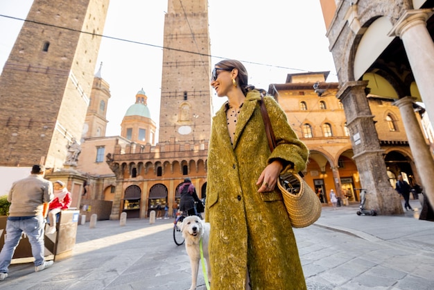 Stylish woman walks the street in bologna city