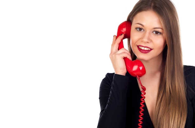 Foto donna alla moda con un telefono rosso