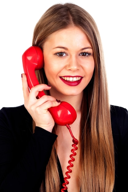 Foto donna alla moda con un telefono rosso