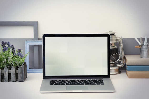 Photo stylish workplace with laptop at home closeup