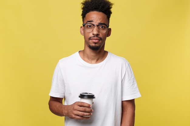 Stylish young afro american man holding cup of takeaway coffee 