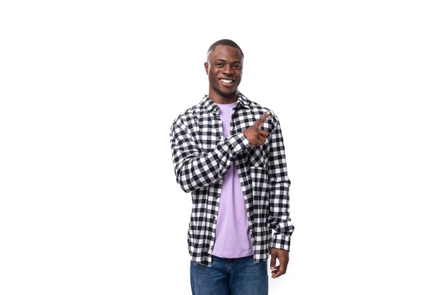 Stylish young american guy with short haircut dressed casually on white background with copy space