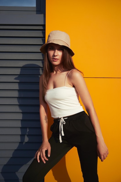 Stylish young woman in bucket hat