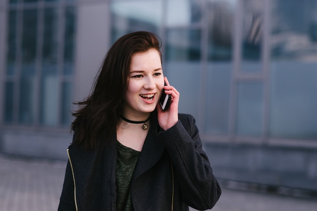 Stylish young woman on the city streets