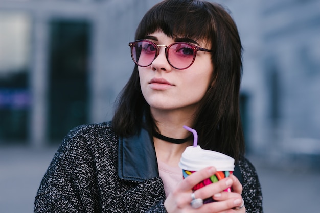 Stylish young woman on the city streets