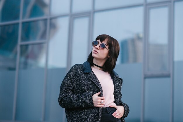 Stylish young woman on the city streets