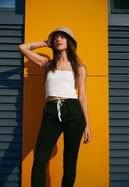 Stylish young woman enjoying sunlight